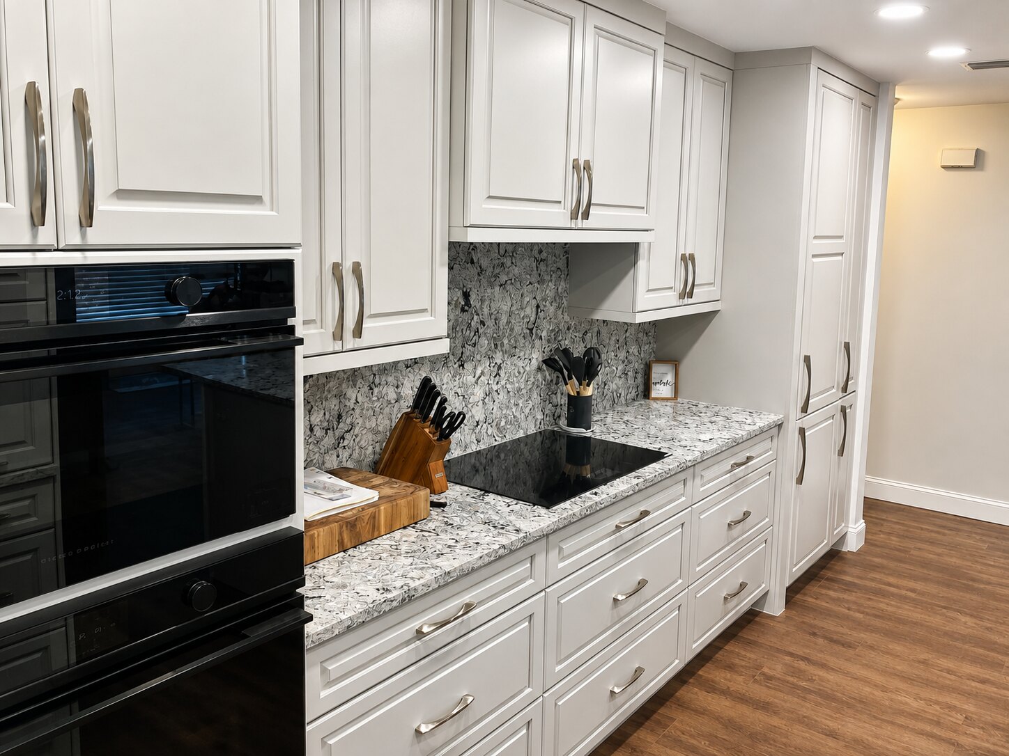 Completed kitchen renovation with coordinated counters and wall surfaces by Proskillz Remodeling