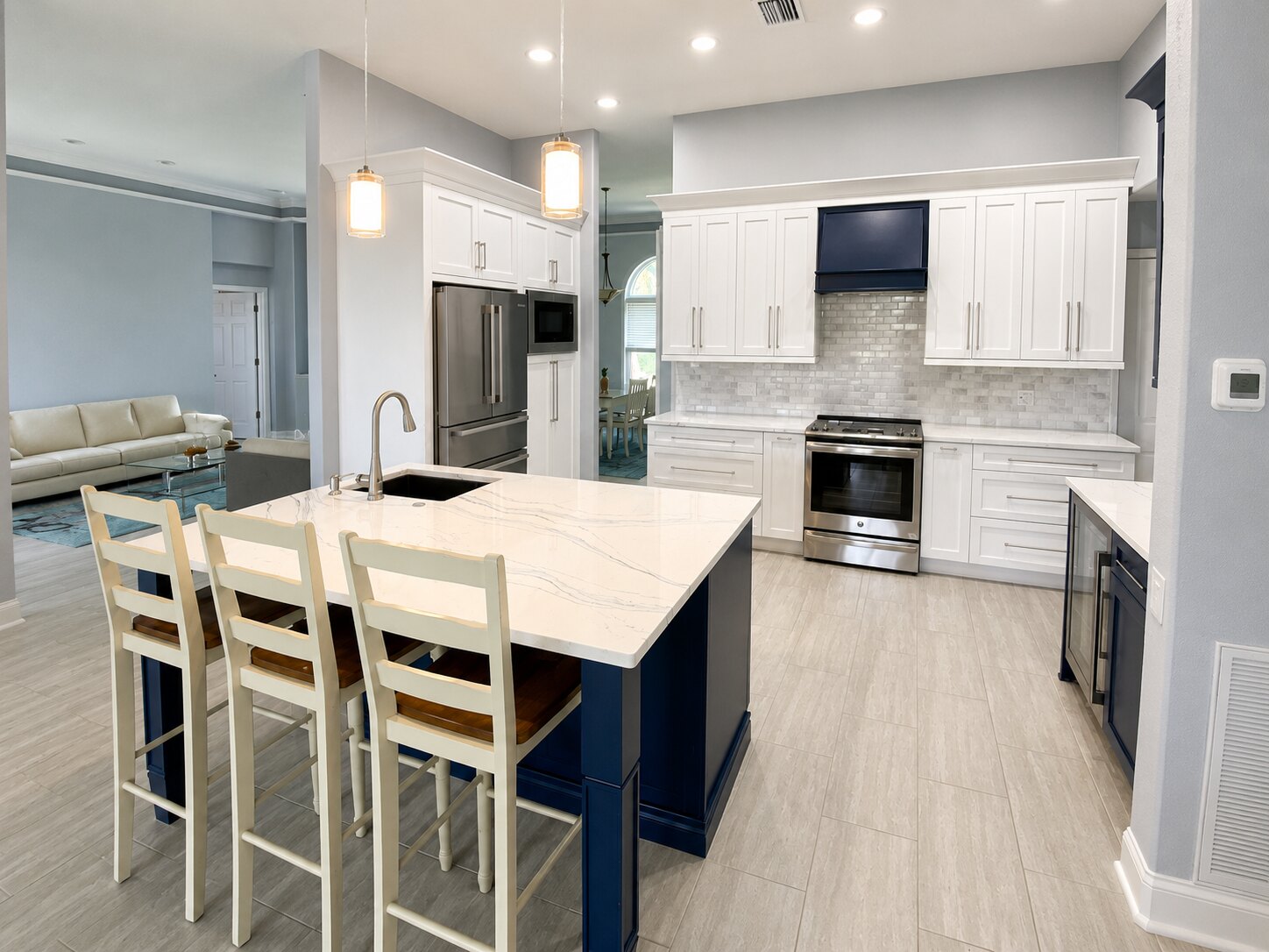 Completed open kitchen renovation with a contrasting island by Proskillz Remodeling