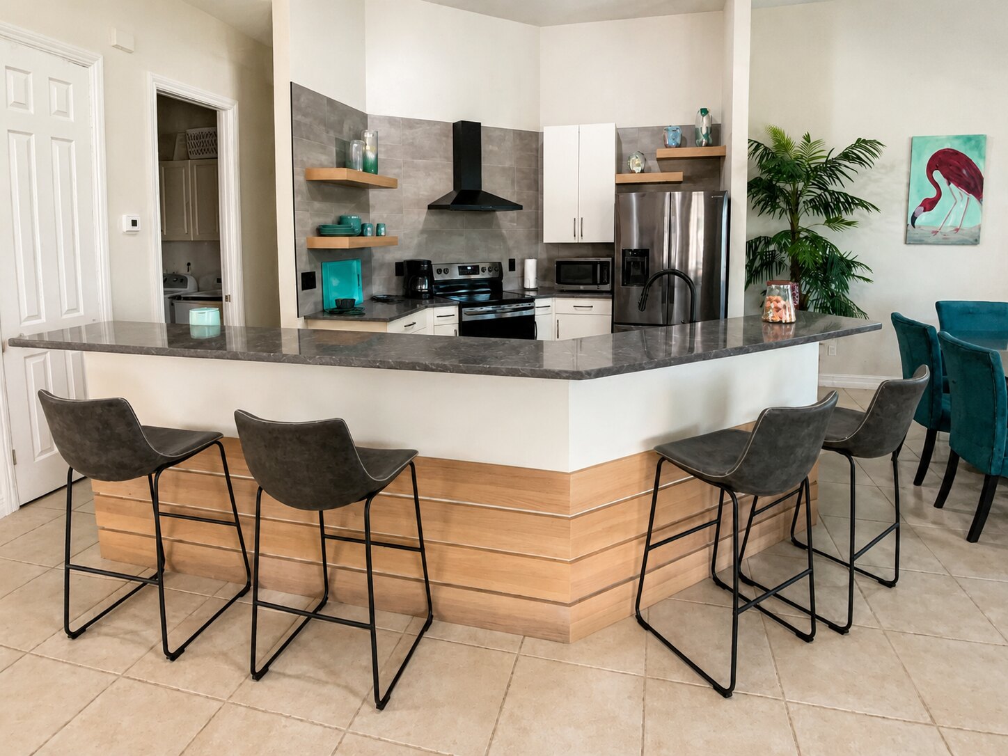 Completed gathering space with seating, lighting and coordinated finishes by Proskillz Remodeling