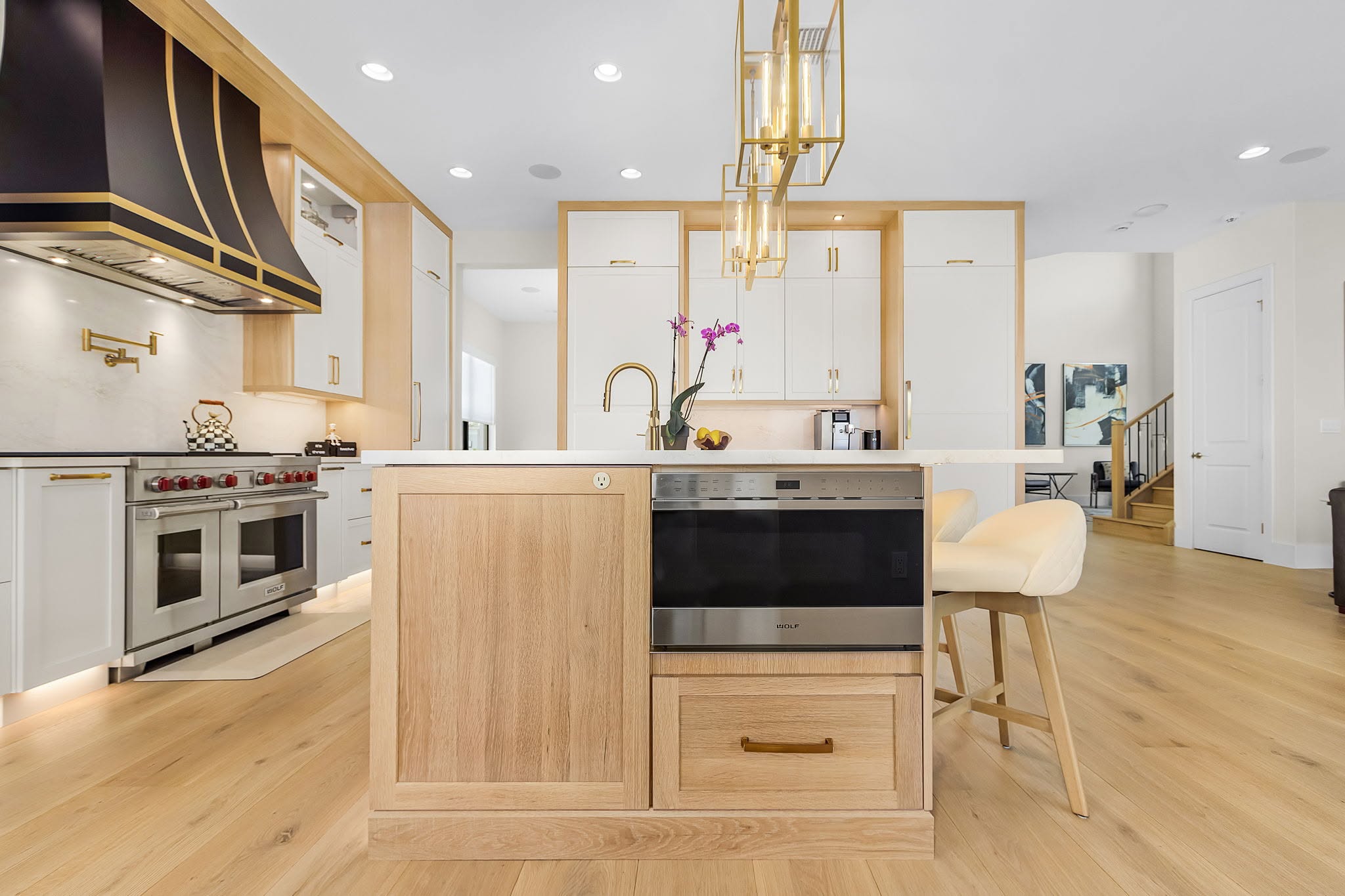 Completed kitchen renovation with appliances, surfaces and finish details working together by Proskillz Remodeling