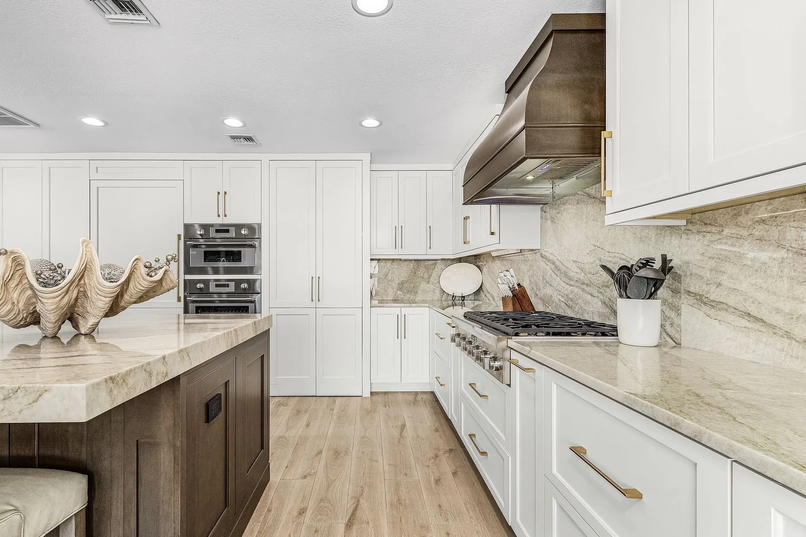 Completed kitchen renovation centered around a coordinated cooking area by Proskillz Remodeling